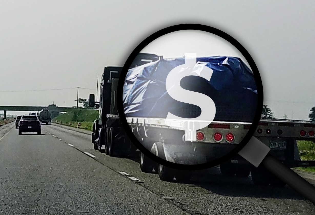 Flatbed On Highway Magnifying Glass