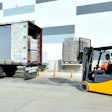 forklift loading a trailer