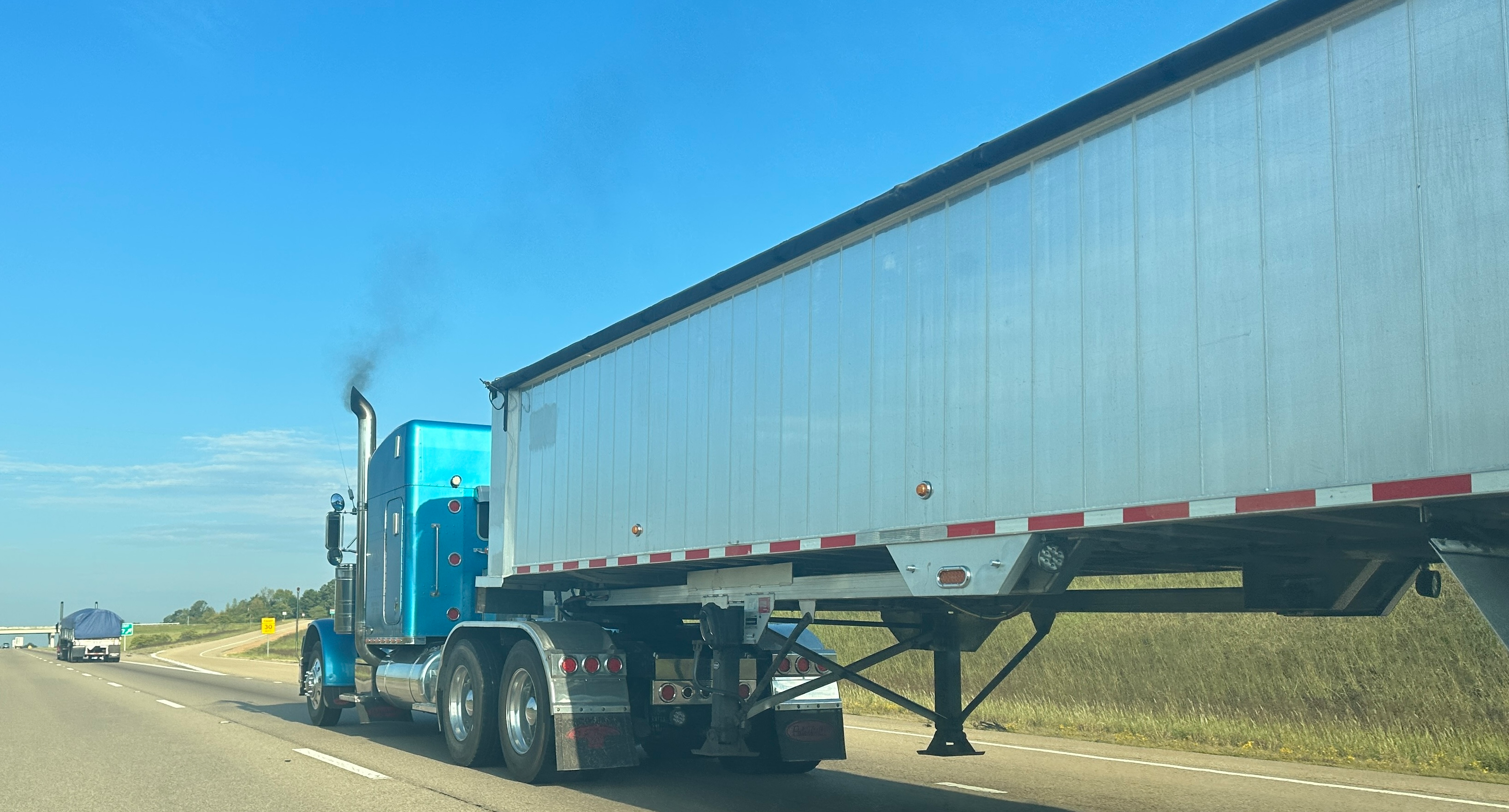 truck on highway with emissions