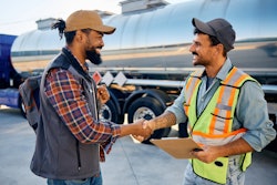 Truck driver shaking hands