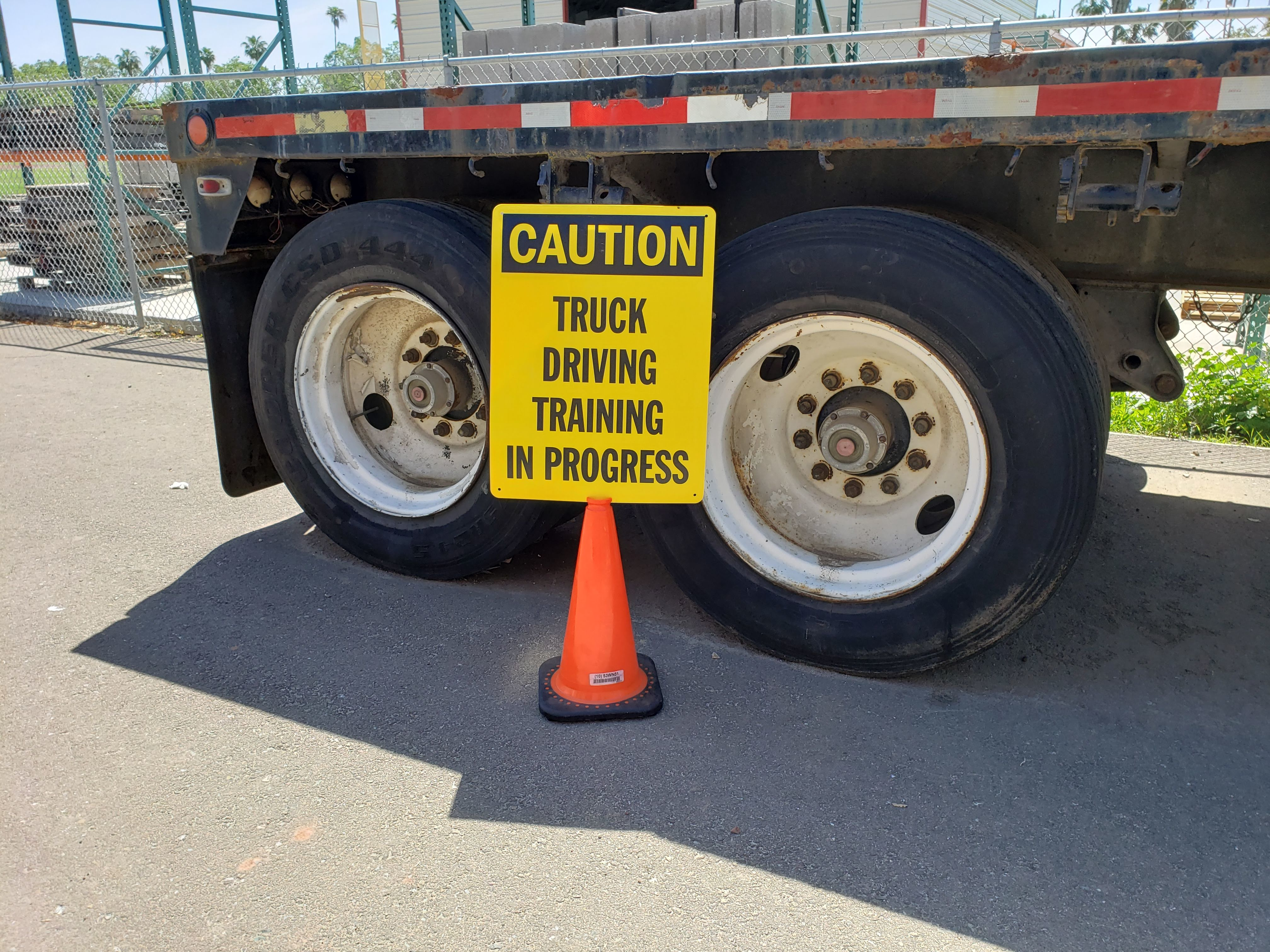 truck driver training in progress sign