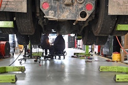 Two Guys Working On Transmission