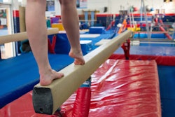 feet on a balance beam