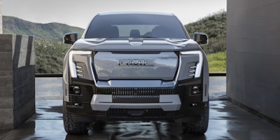 front of new Sierra EV Denali
