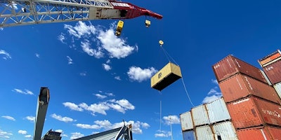 crane removing containers from the ship that caused the collapse