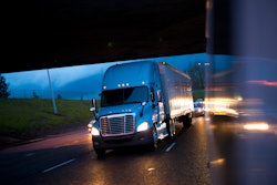 Semi truck with headlights on