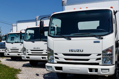 Isuzu trucks in a line