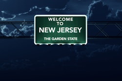New Jersey welcome sign at night