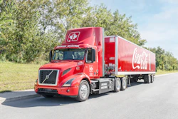 Coke-branded Volvo VNR Electric driving