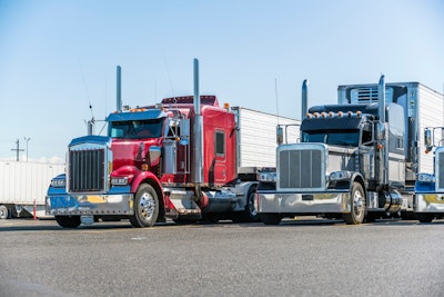 semi trucks in a parking lot