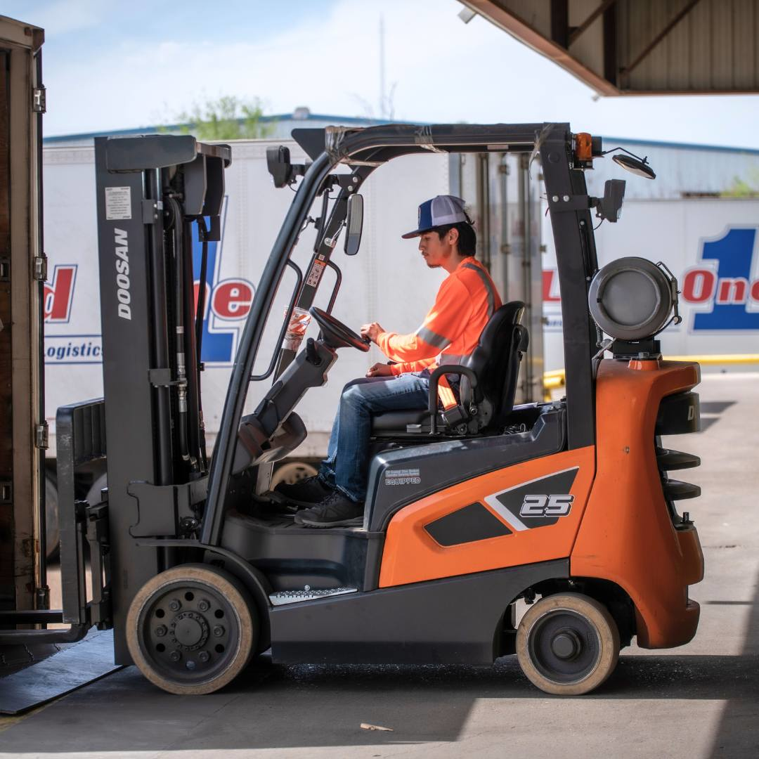 man driving a forklift