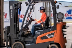 man driving a forklift