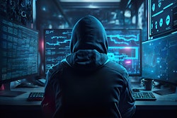 cyber hacker sitting at a computer