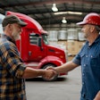 truck drivers shaking hands