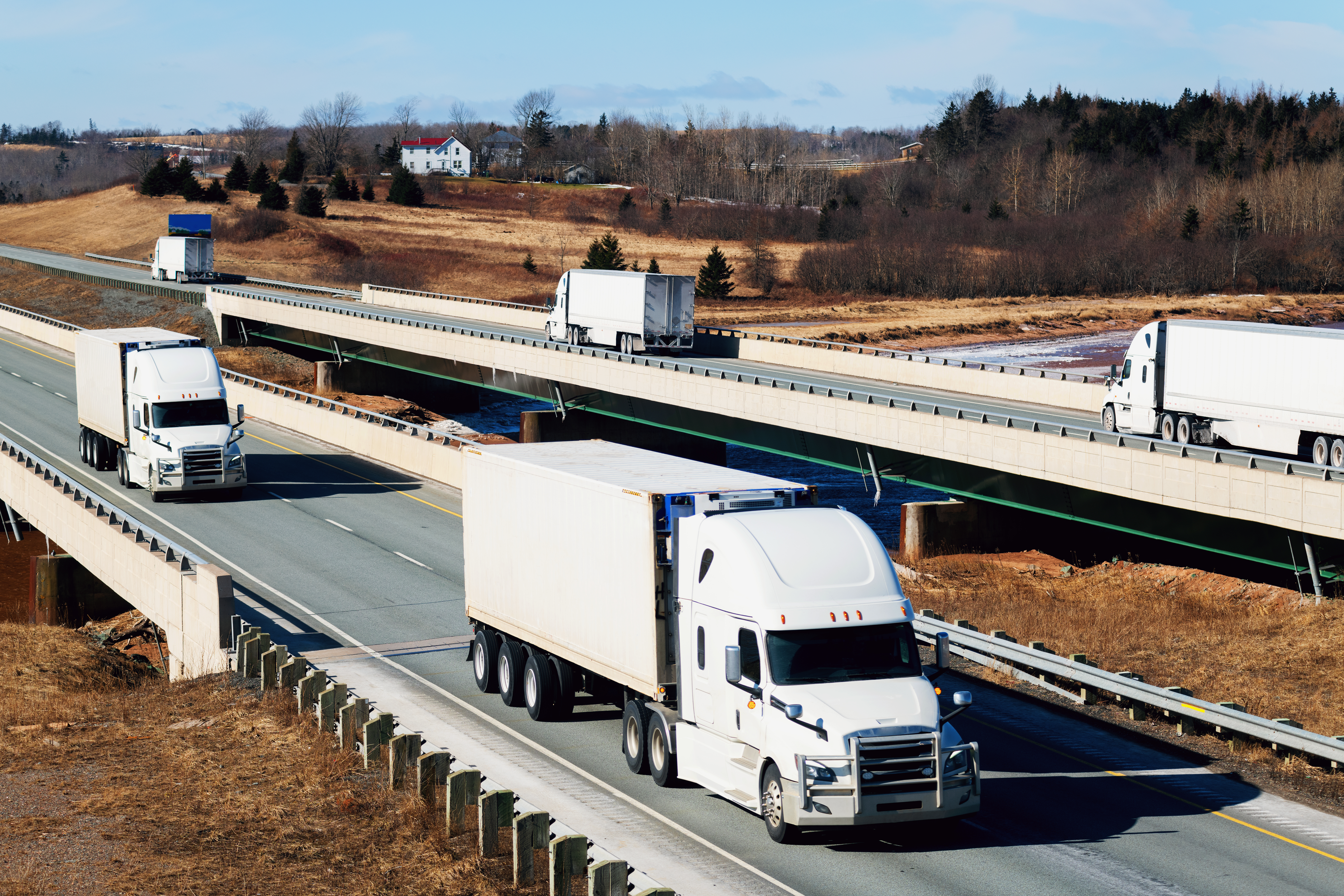 trucks on highway crossing bridges
