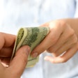 handing over money