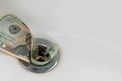 money going down a drain