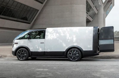 A white Canoo van with the cargo doors open