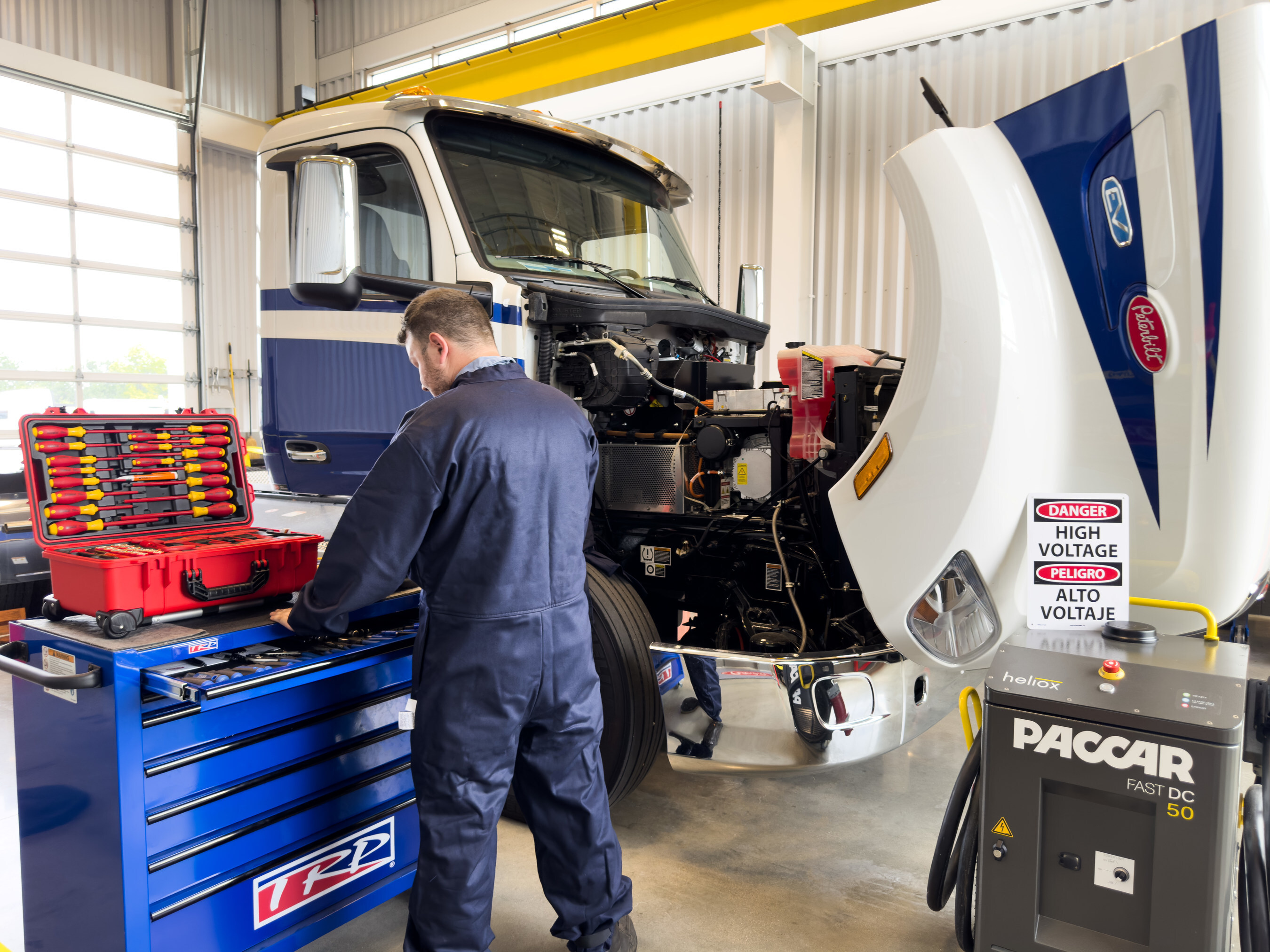 A mechanic working on a truck.