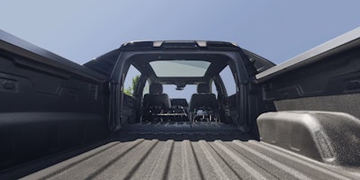 2025 Chevy Silverado EV view of bed with fold-down bed extending into cab