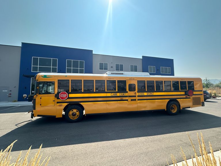 A school bus parked in front of a building