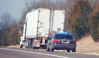 truck pulled over by police at roadside