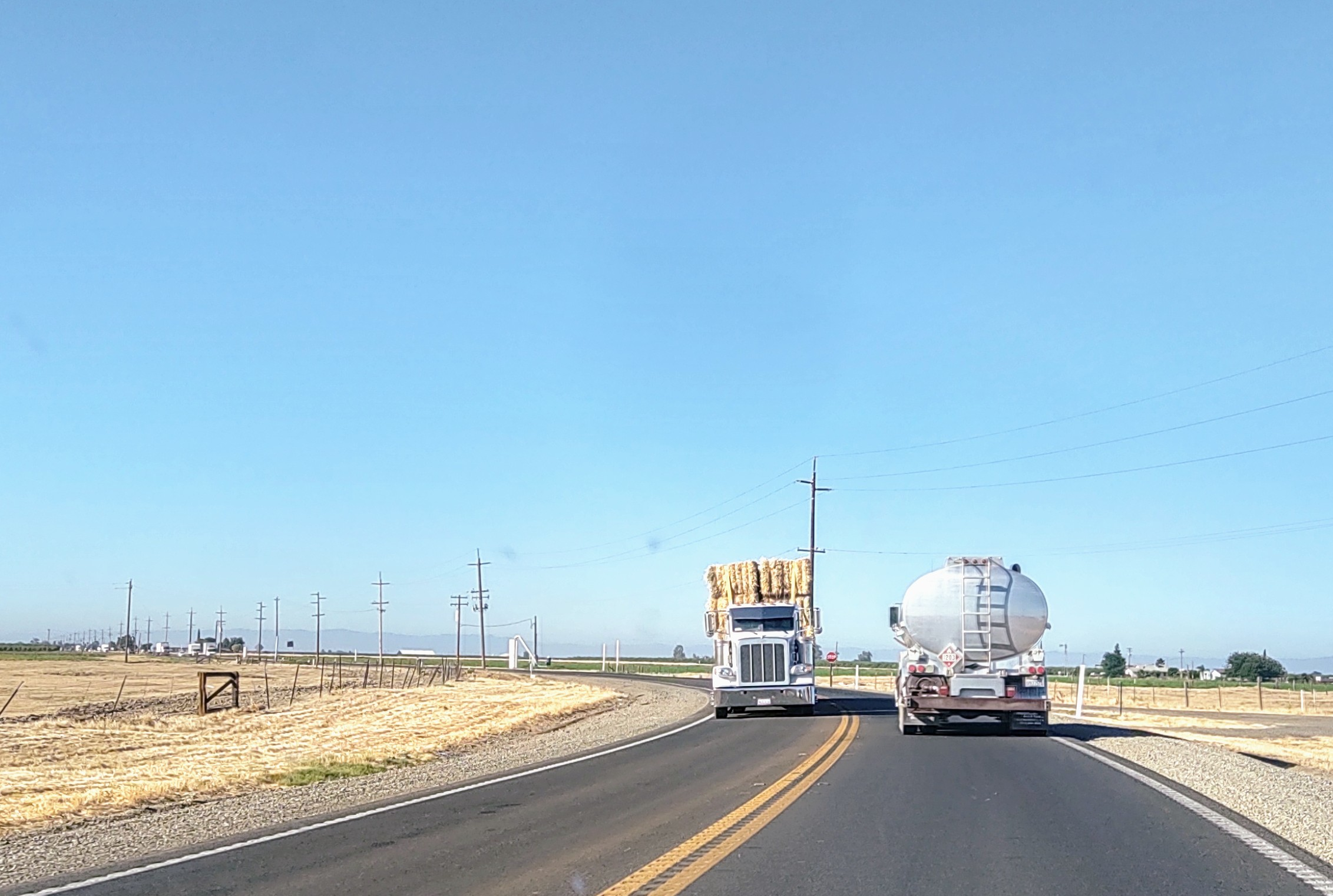 Tanker Hay Wagon On Highway