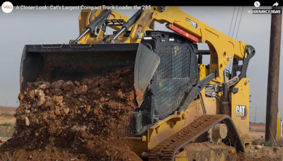 Screenshot Cat 285 compact track loader dumping dirt