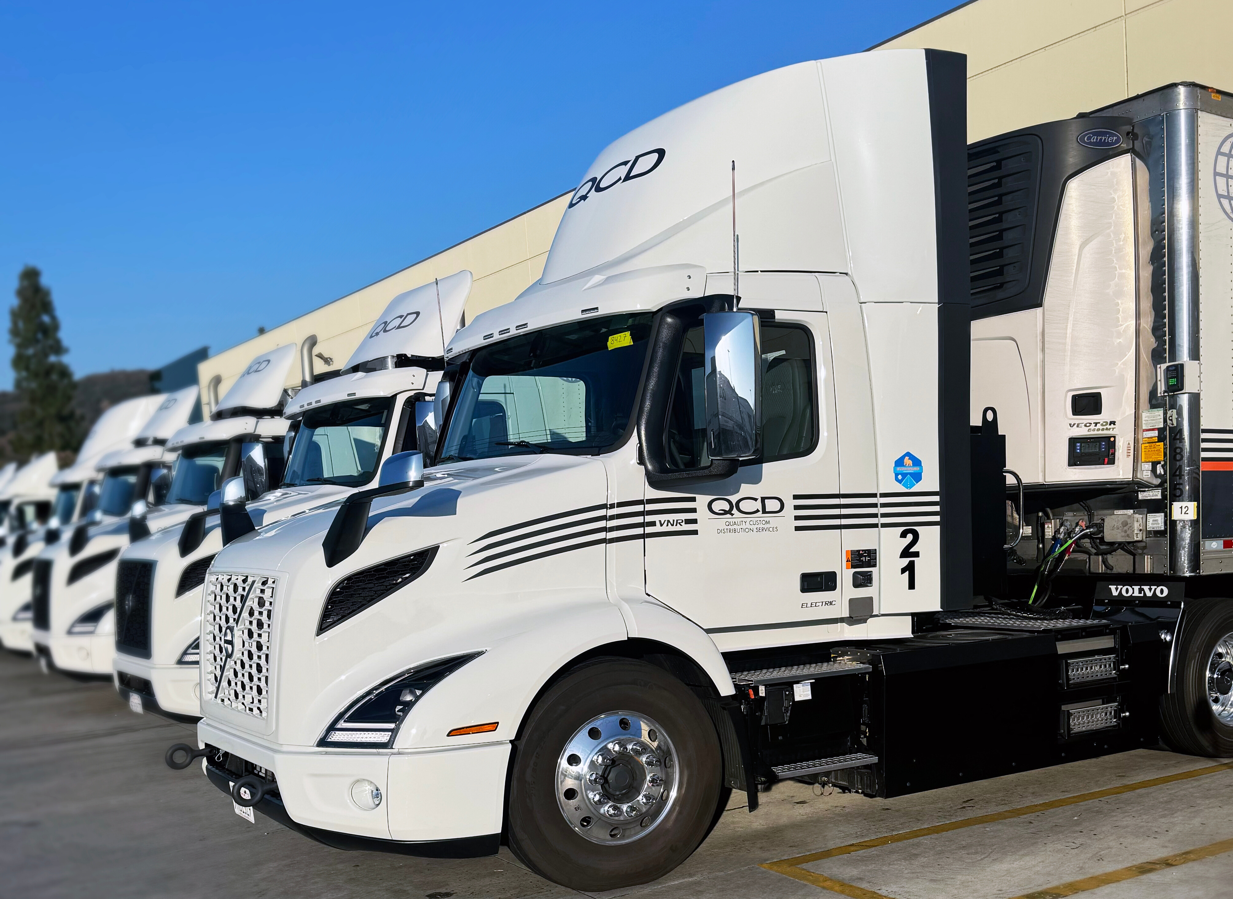 QCD's Volvo VNR Electrics parked