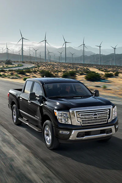 2024 nissan titan pickup truck windmills background