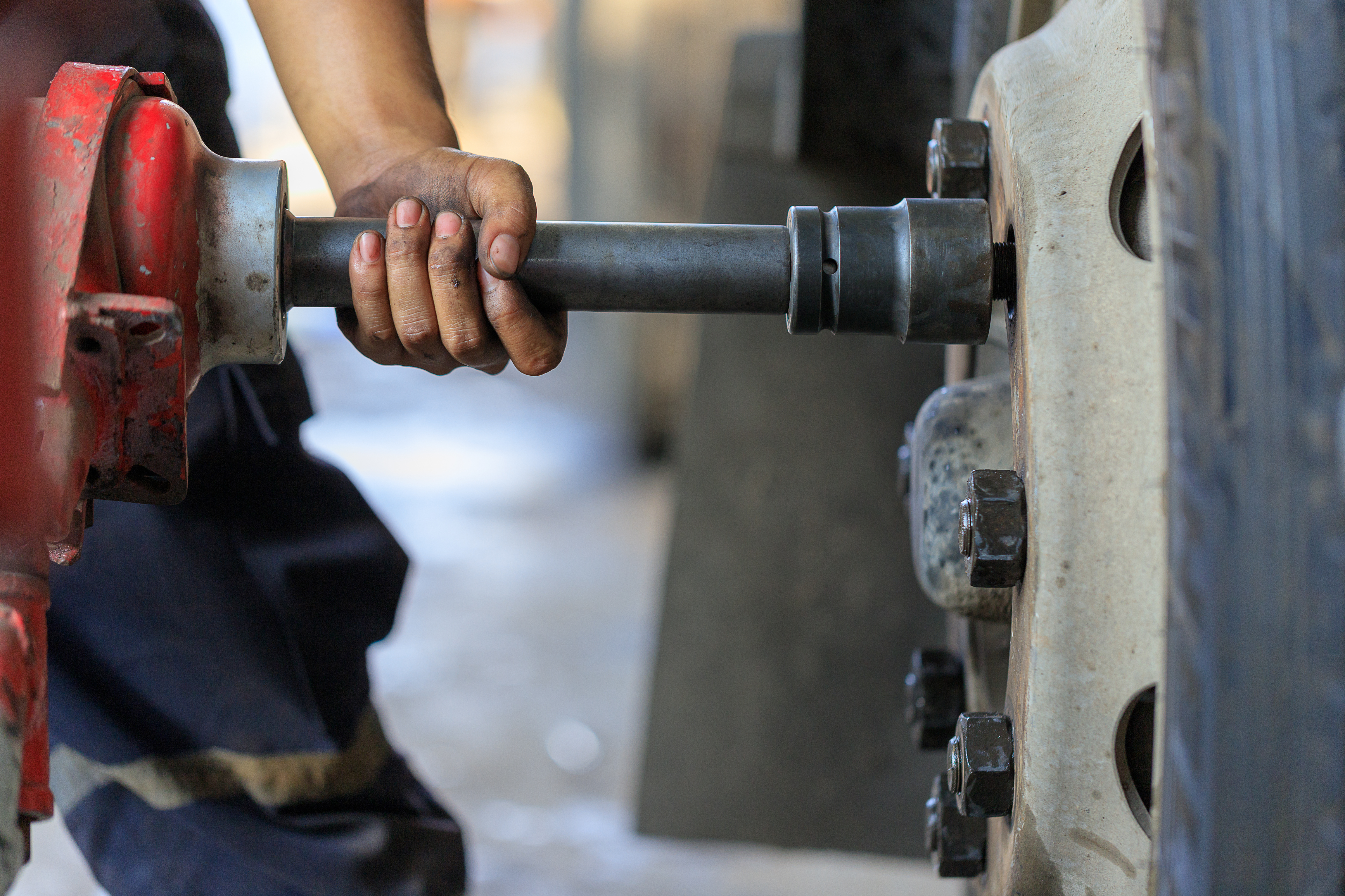 technician removing a commercial truck tire