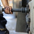 technician removing a commercial truck tire