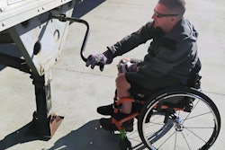 Truck driver Doug Teal lowers landing gear