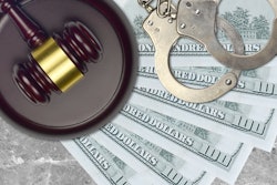 cash with handcuffs and gavel