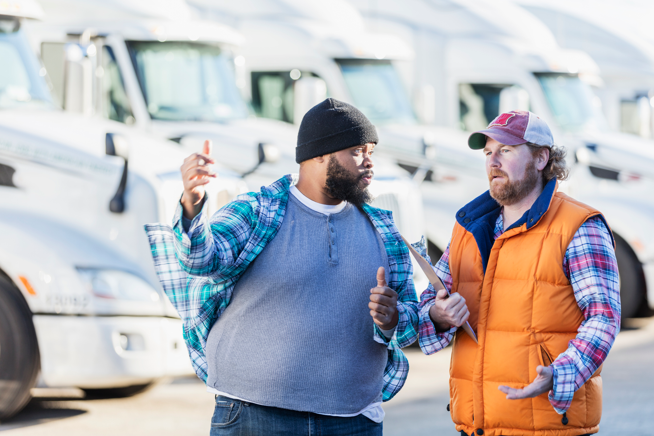 Two men frustratedly discussing a used truck sale