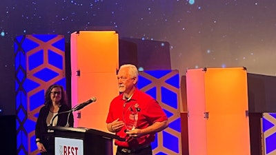 Theron Thompson, an owner-operator with K&J Trucking, accepts the Best Fleet to Drive For award in the small fleet category.