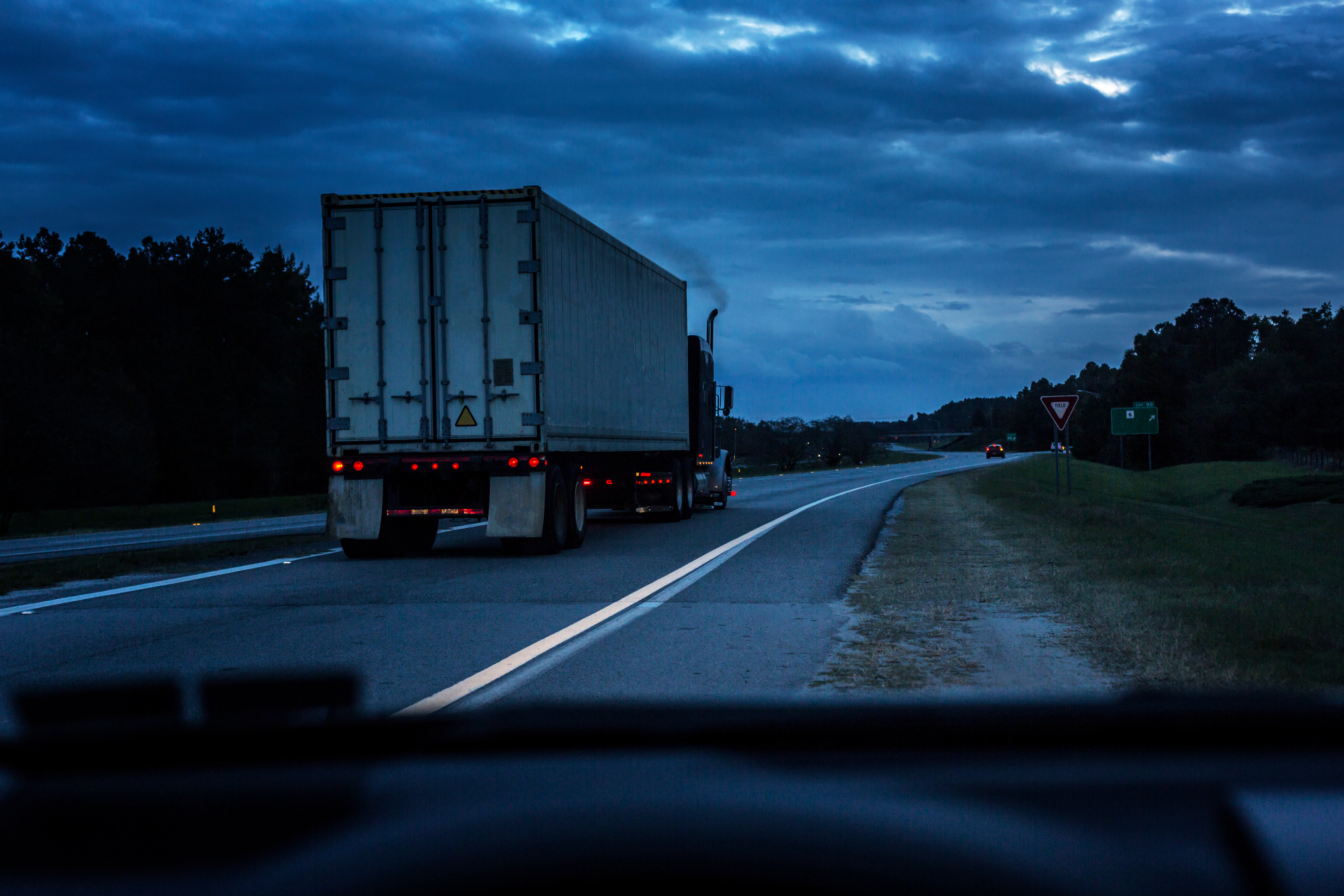 Truck on road with smoke
