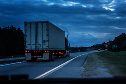 Truck on road with smoke