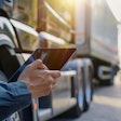 Truck driver using a tablet