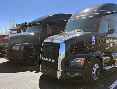Mack trucks side by side