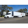 Joyride Logistics' Windrose EV semi truck parked on city street with trees