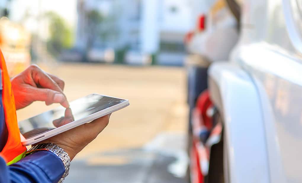 Construction worker using tablet for digital site documentation