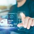 Futuristic electric truck interface with holographic data visualization and interactive touchscreen