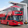 Red double-decker bus number 132 to North Greenwich at charging station