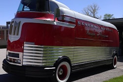 Classic red and white General Motors Futurliner bus from mid-20th century.