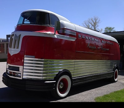 Classic red and white General Motors Futurliner bus from mid-20th century.