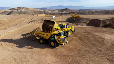 An autonomous Komatsu HD605-10 running on Komatsu Smart Quarry Autonomous, powered by Pronto, is being loaded at Komatsu’s Arizona Proving Grounds.