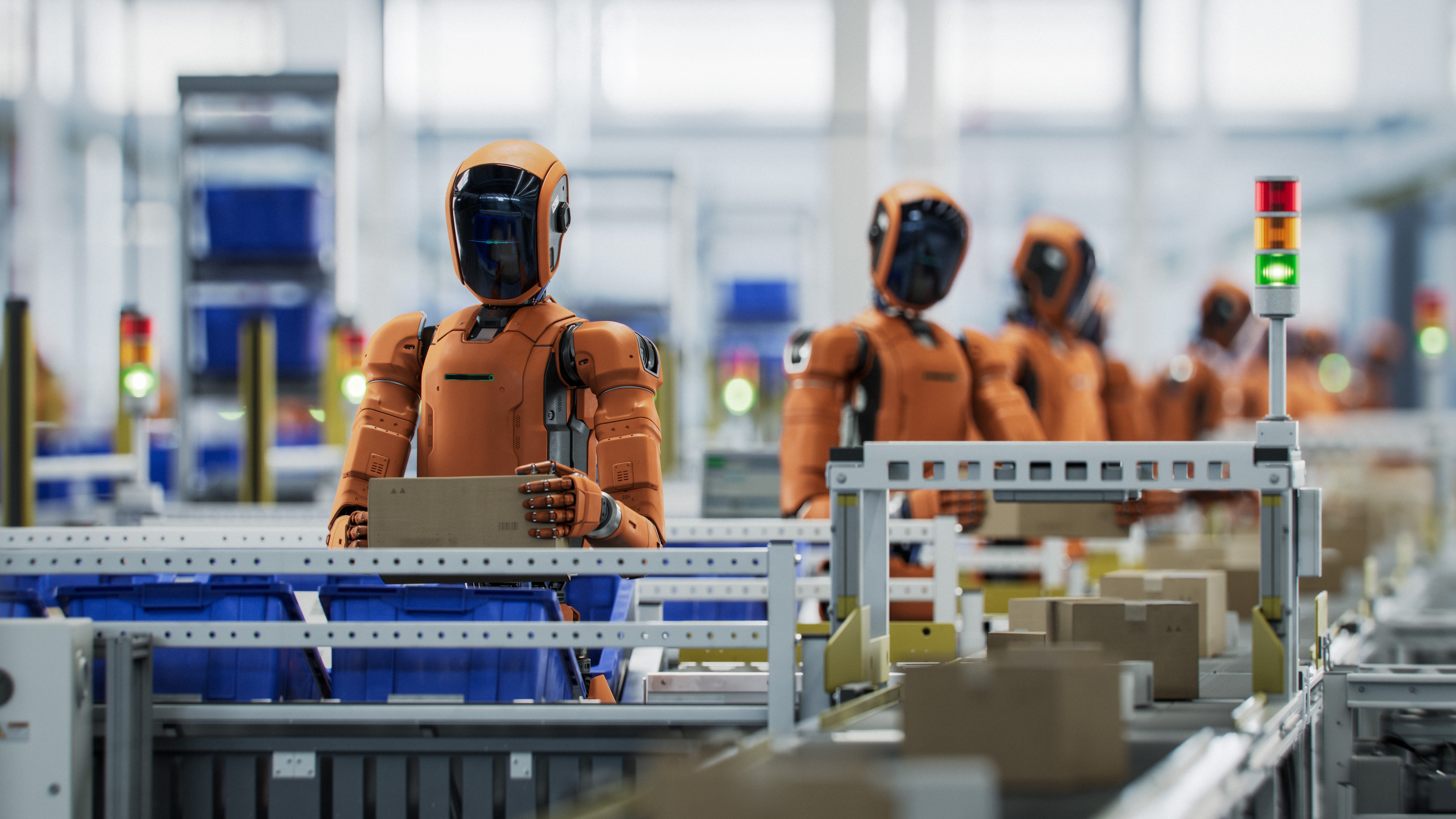 Orange industrial robots working on an automated assembly line with machinery