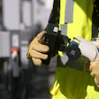 ChargeHelp! technician holds an EV charger
