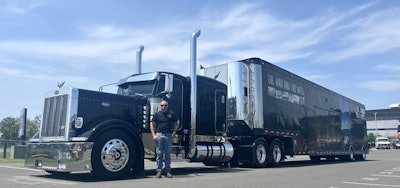 Cliff Hay is shown here with that 2007 379 Legacy, in the midst of the only work it does in its retirement -- hauling the the mobile Vietnam Wall that Heals memorial.